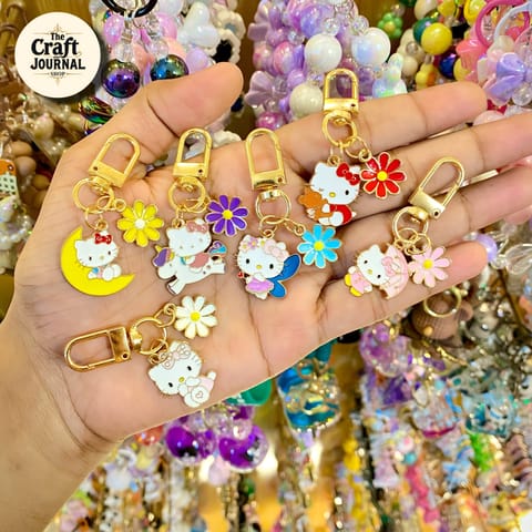 Enamel Kitty Character & Flower Charm Keychain – Gold Bag Accessory
